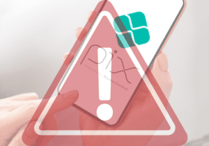 Símbolo de cuidado e logomarca do PIX na tela do telefone celular.